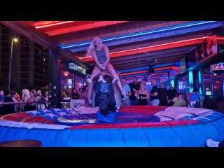 benidorm bull ride fail pretty girl on mechanical bull. spain 4k. september 2024